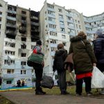 Residents survey the damage from a drone attack. (Photo: Reuters)