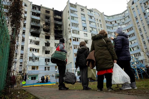 Residents survey the damage from a drone attack. (Photo: Reuters)