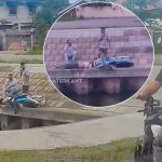 Bromfiets ligt langs de damwand na ongeval in Amazonestraat, Suriname. Oorzaak: alcoholgebruik. Politie onderzoekt.