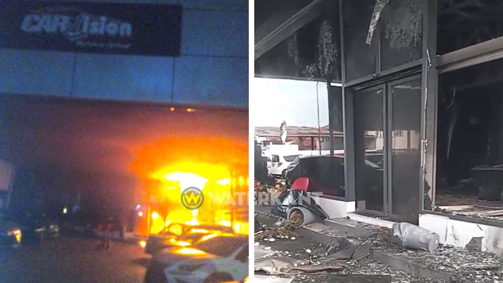 Verwoeste kantoorruimte van Carvision in Suriname na nachtelijke brand, onderzoek naar oorzaak gaande.